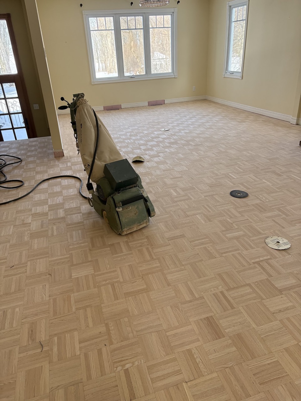 Dustless sanding in progress on a real Planchers Locas hardwood floor project