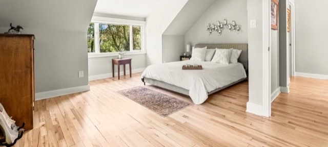 Freshly finished hardwood floor in a bright bedroom