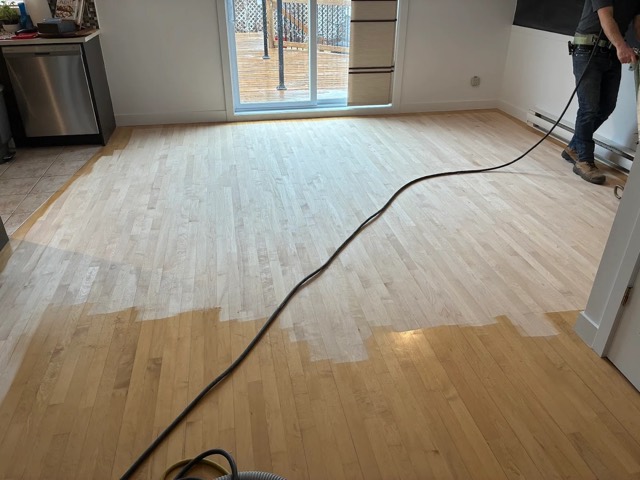 Hardwood floor being sanded by Planchers Locas